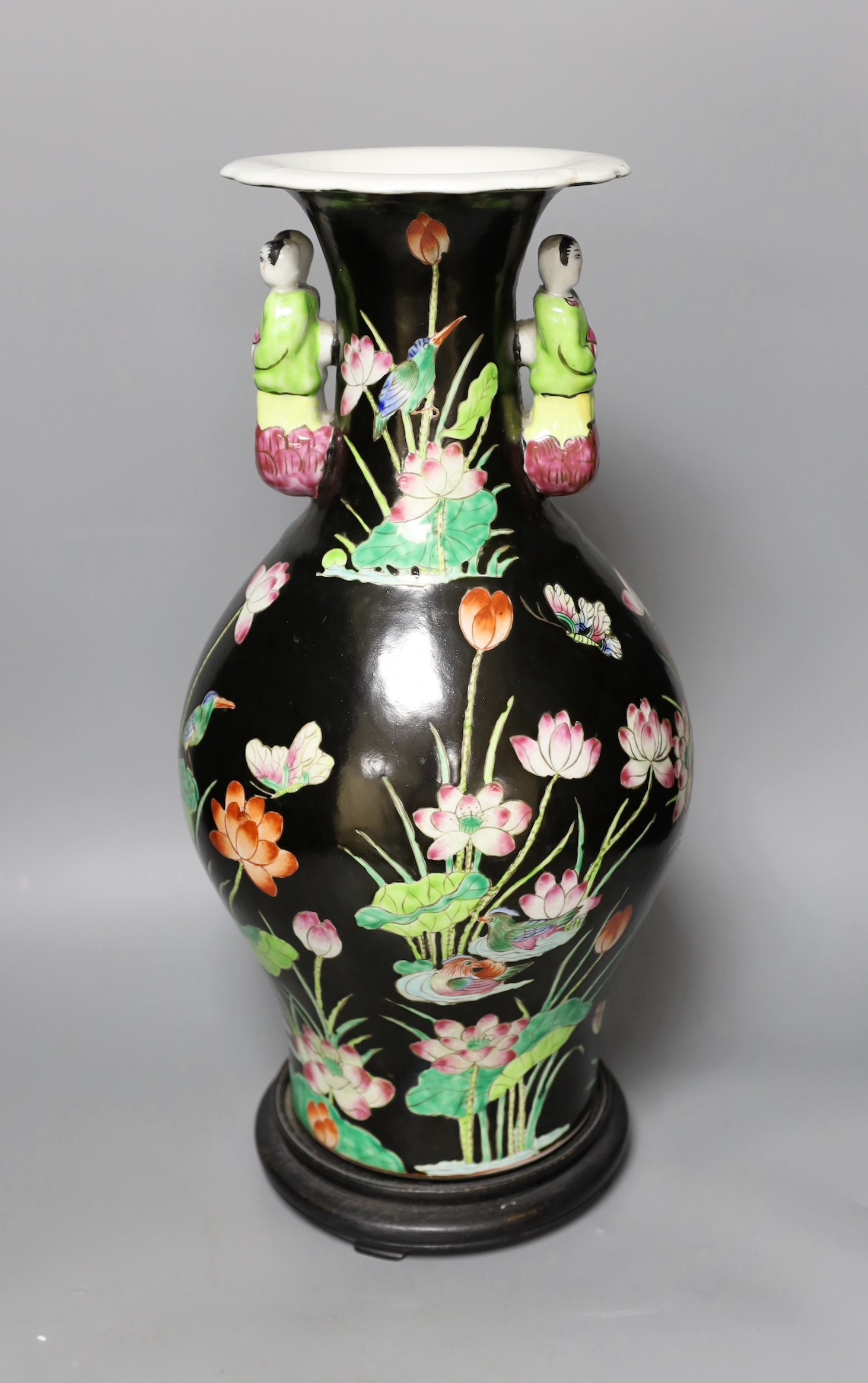 A Chinese famille noire vase, on plinth, 46 cms high